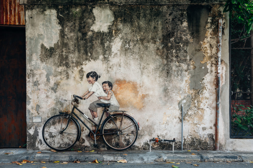 Mural Kids on bicycle by Ernest Zacharevic