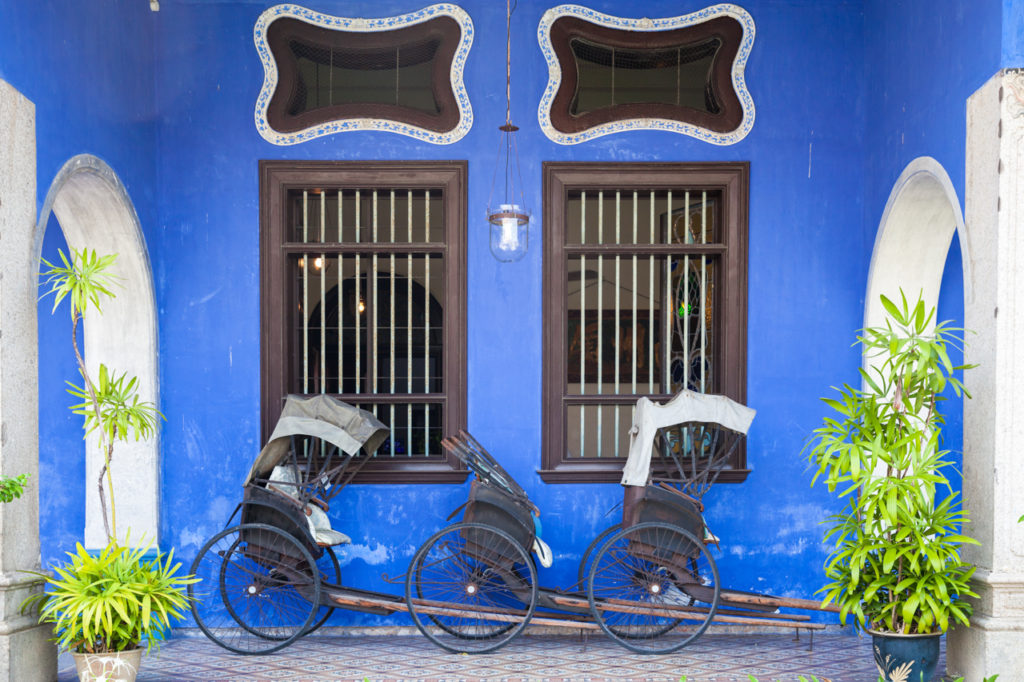 Old rickshaw tricycles near Fatt Tze Mansion also known as Blue Mansion