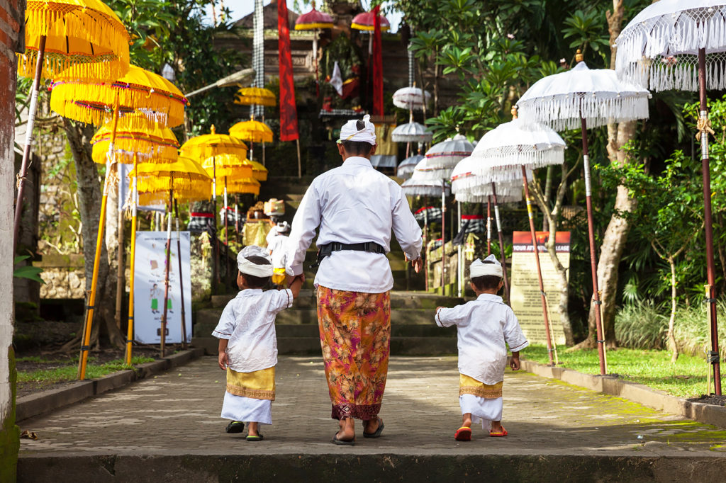 The Balinese family at the temple in Ubud, Bali, Indonesia