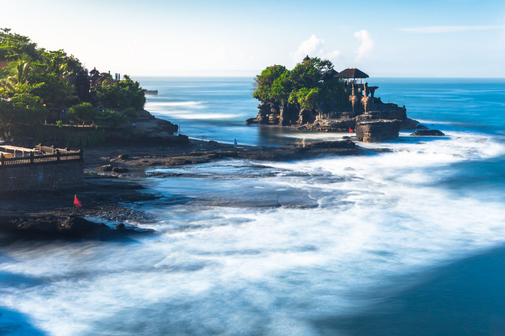 Pura Tanah Lot temple washed by the Ocean waves, Bali, Indonesia