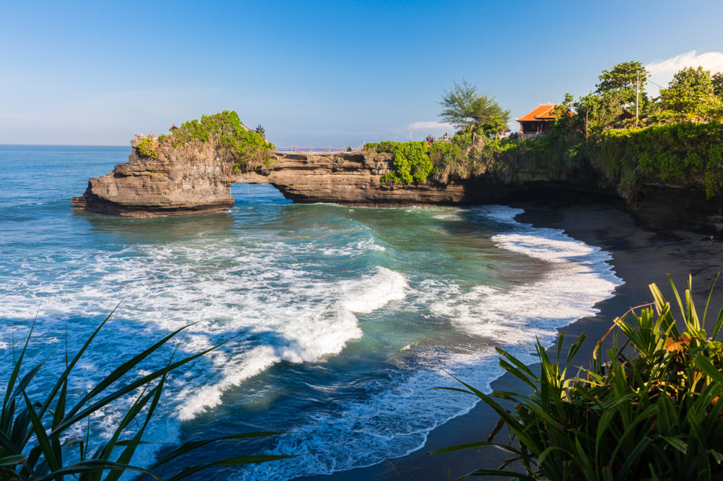 The Pura Batu Bolong temple on the beautiful rock, Tanah Lot, Bali, Indonesia