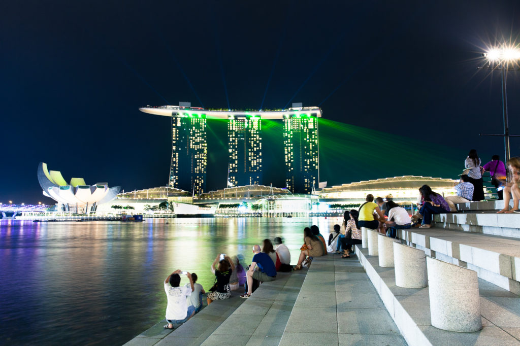 People watching the show from Merlion Park on the other side of Marina Bay